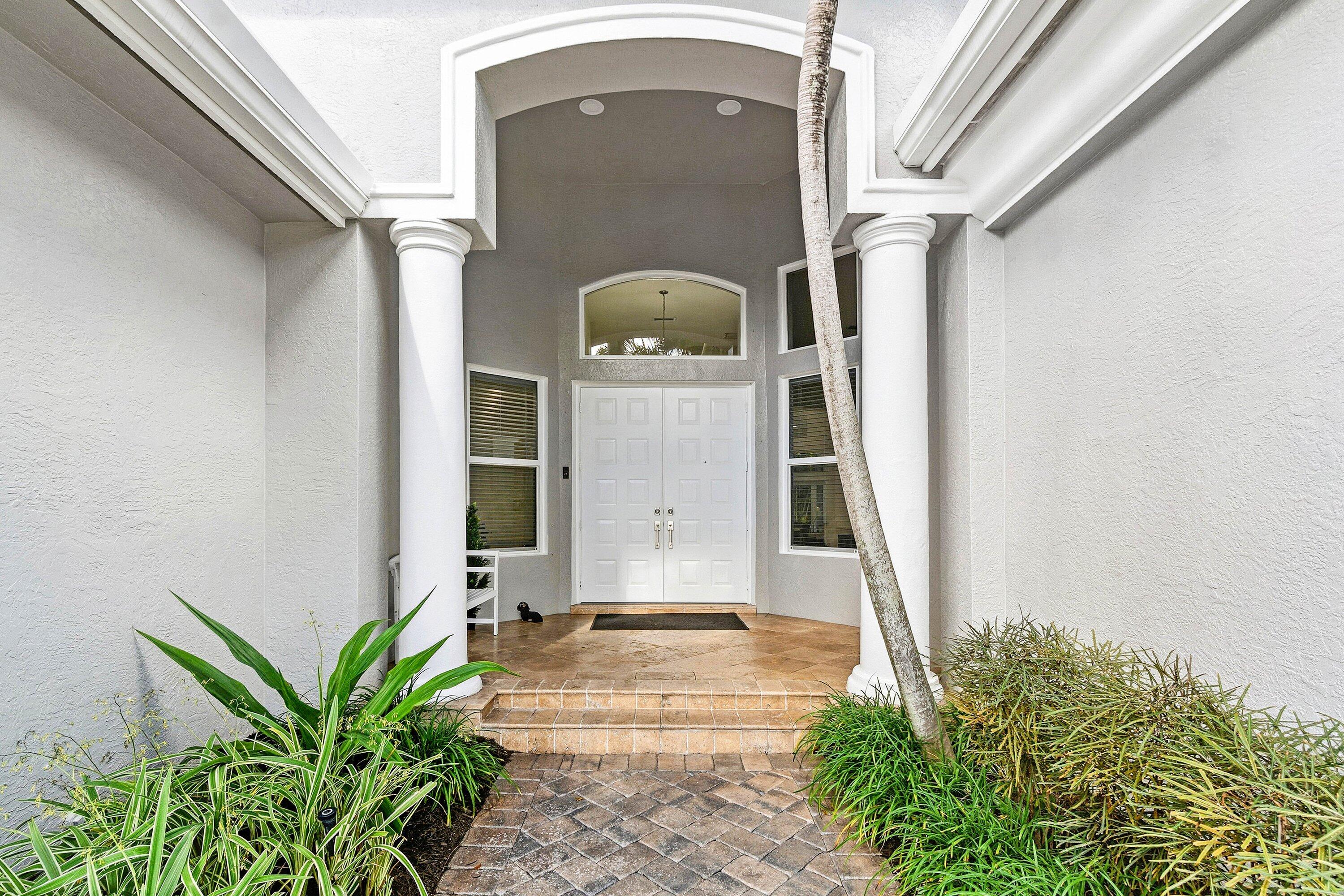 2358 Northwest 49th Lane Boca Raton, FL 33431 - Photo 47 of 47 a front view of a house with a yard