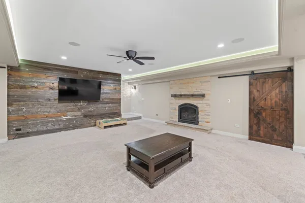 a living room with furniture and a fireplace