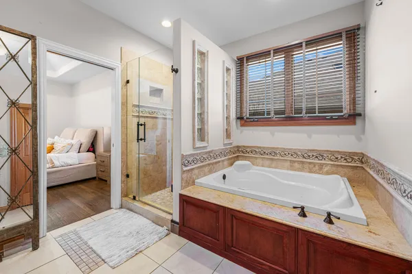 a bathroom with a tub and a shower