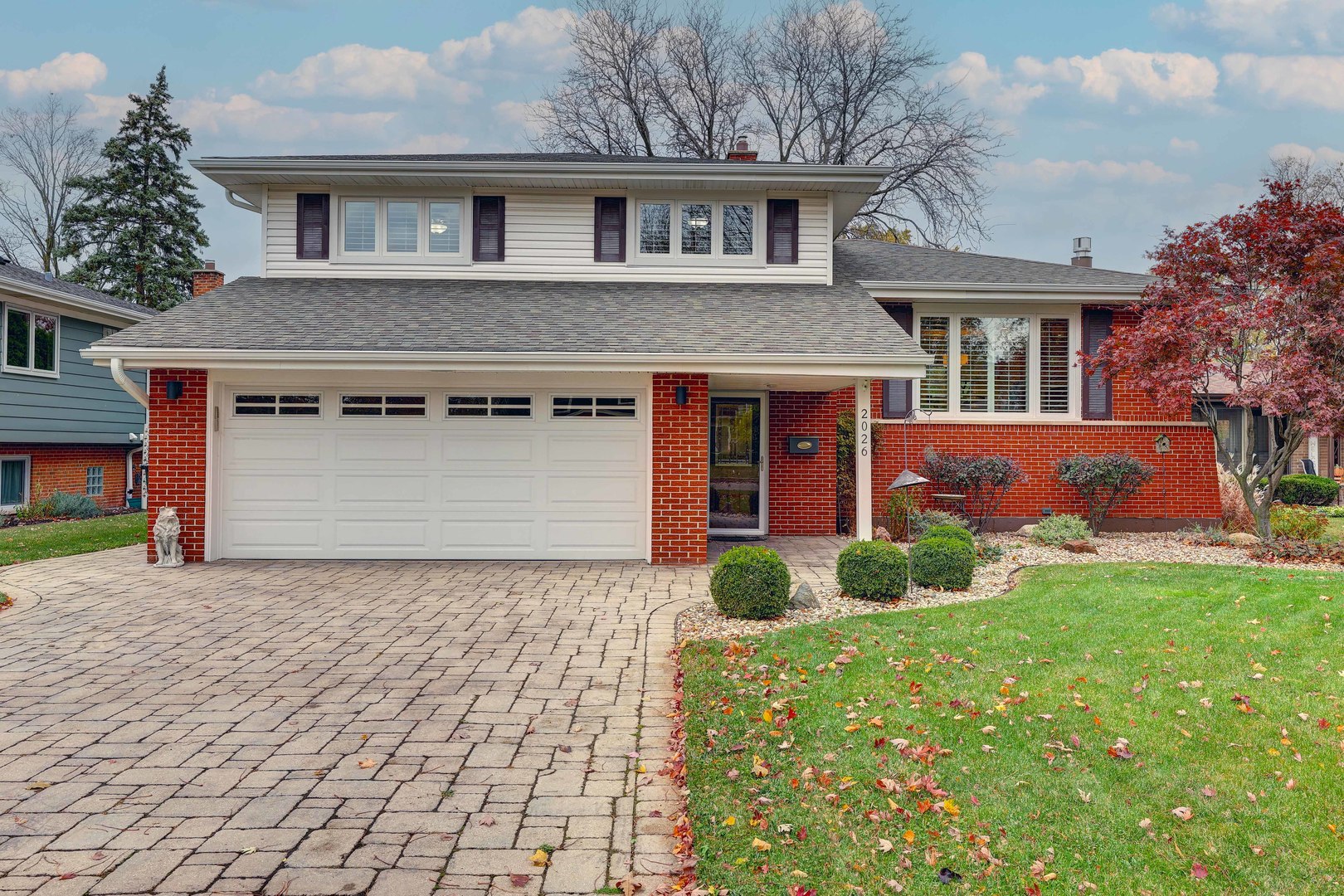 2026 Irwin Avenue Park Ridge, IL 60068 - Photo 1 of 39 a front view of a house with garden