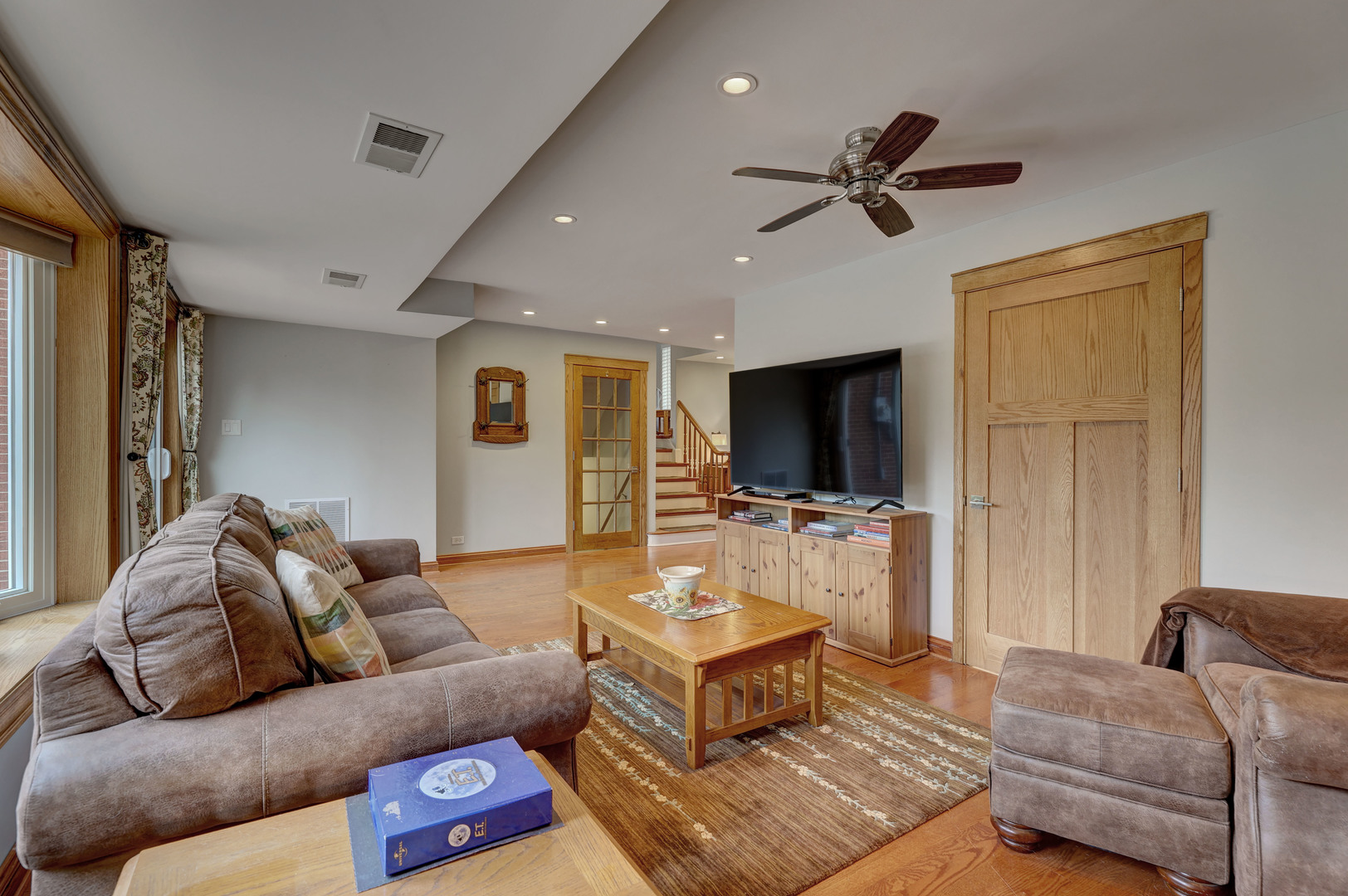 2026 Irwin Avenue Park Ridge, IL 60068 - Photo 12 of 39 a living room with furniture and a flat screen tv