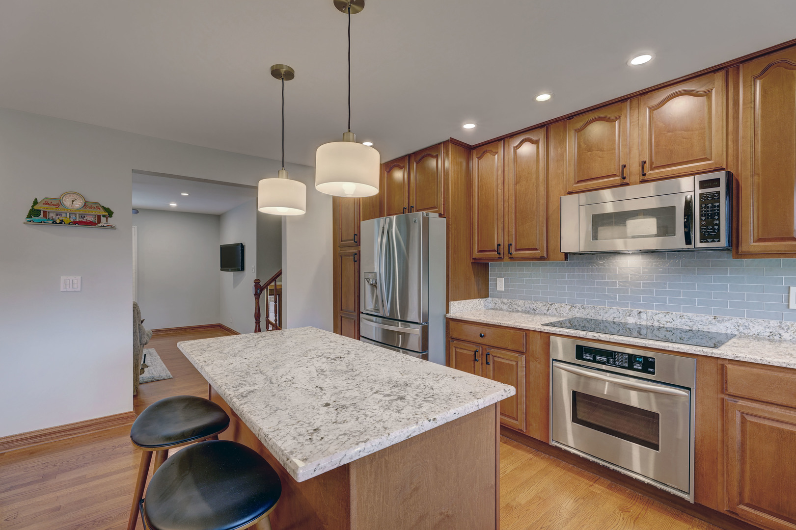 2026 Irwin Avenue Park Ridge, IL 60068 - Photo 14 of 39 a kitchen with kitchen island a sink stainless steel appliances and wooden floor