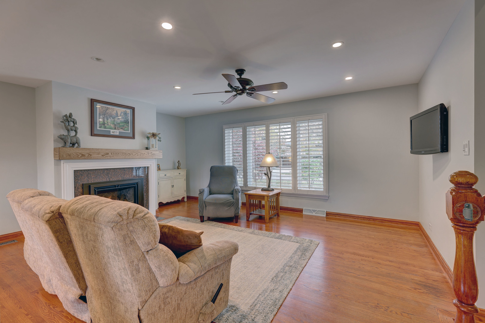 2026 Irwin Avenue Park Ridge, IL 60068 - Photo 17 of 39 a living room with furniture a fireplace and a flat screen tv