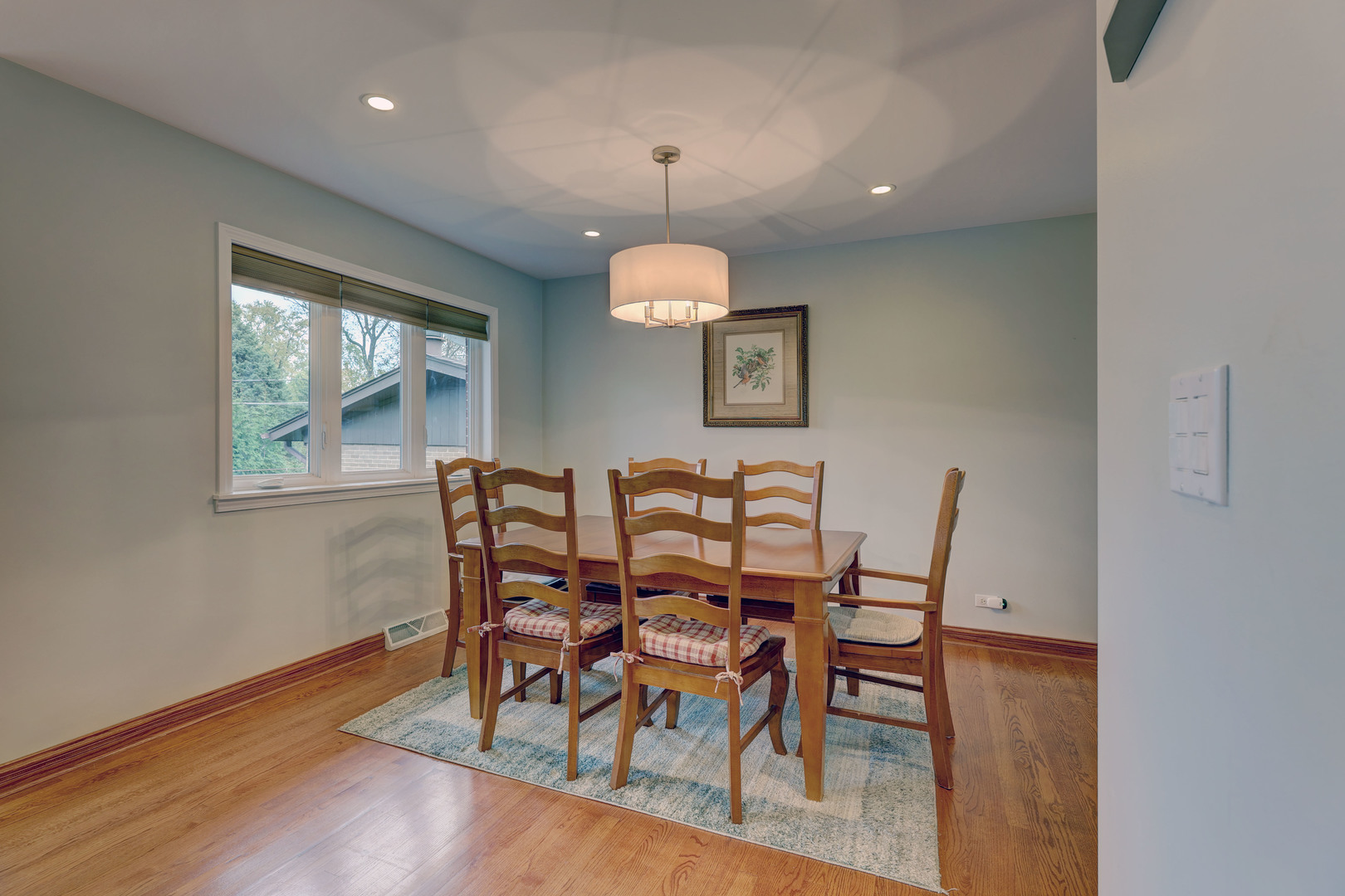 2026 Irwin Avenue Park Ridge, IL 60068 - Photo 18 of 39 a view of a dining room with furniture window and wooden floor