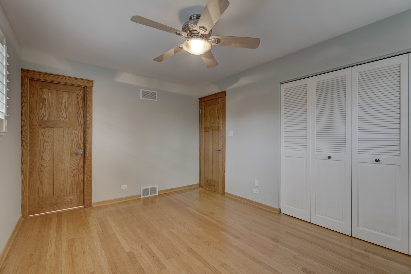 2026 Irwin Avenue Park Ridge, IL 60068 - Photo 22 of 39 a view of an empty room with wooden floor
