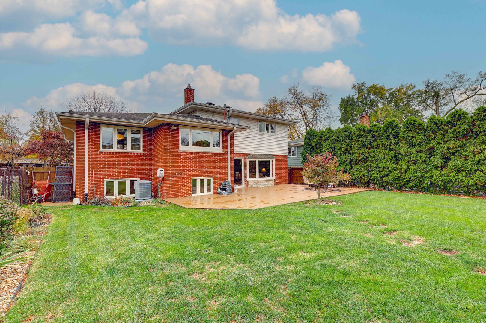 2026 Irwin Avenue Park Ridge, IL 60068 - Photo 31 of 39 a view of a house with a yard deck and a large tree