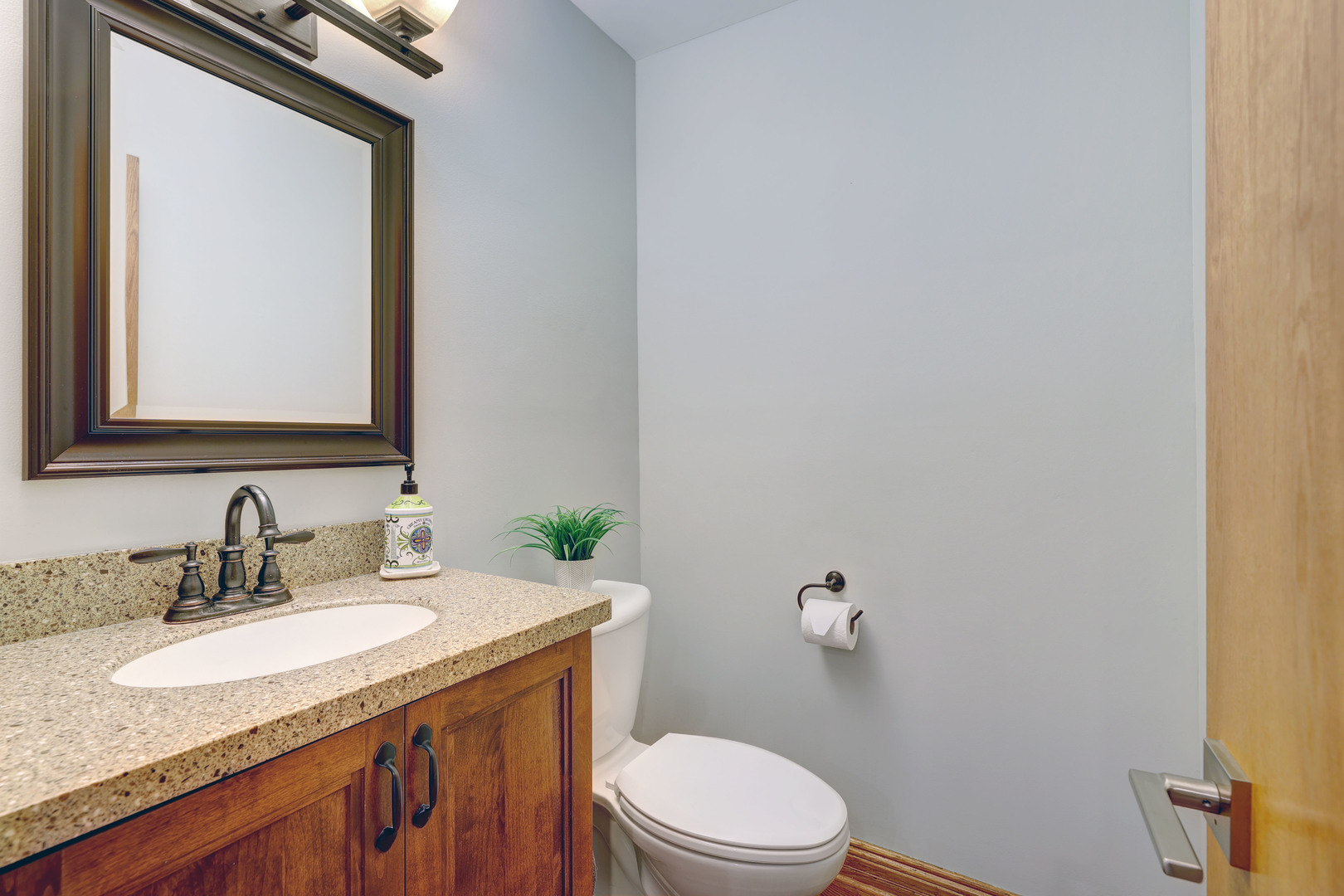 2026 Irwin Avenue Park Ridge, IL 60068 - Photo 5 of 39 a bathroom with a granite countertop sink toilet and mirror