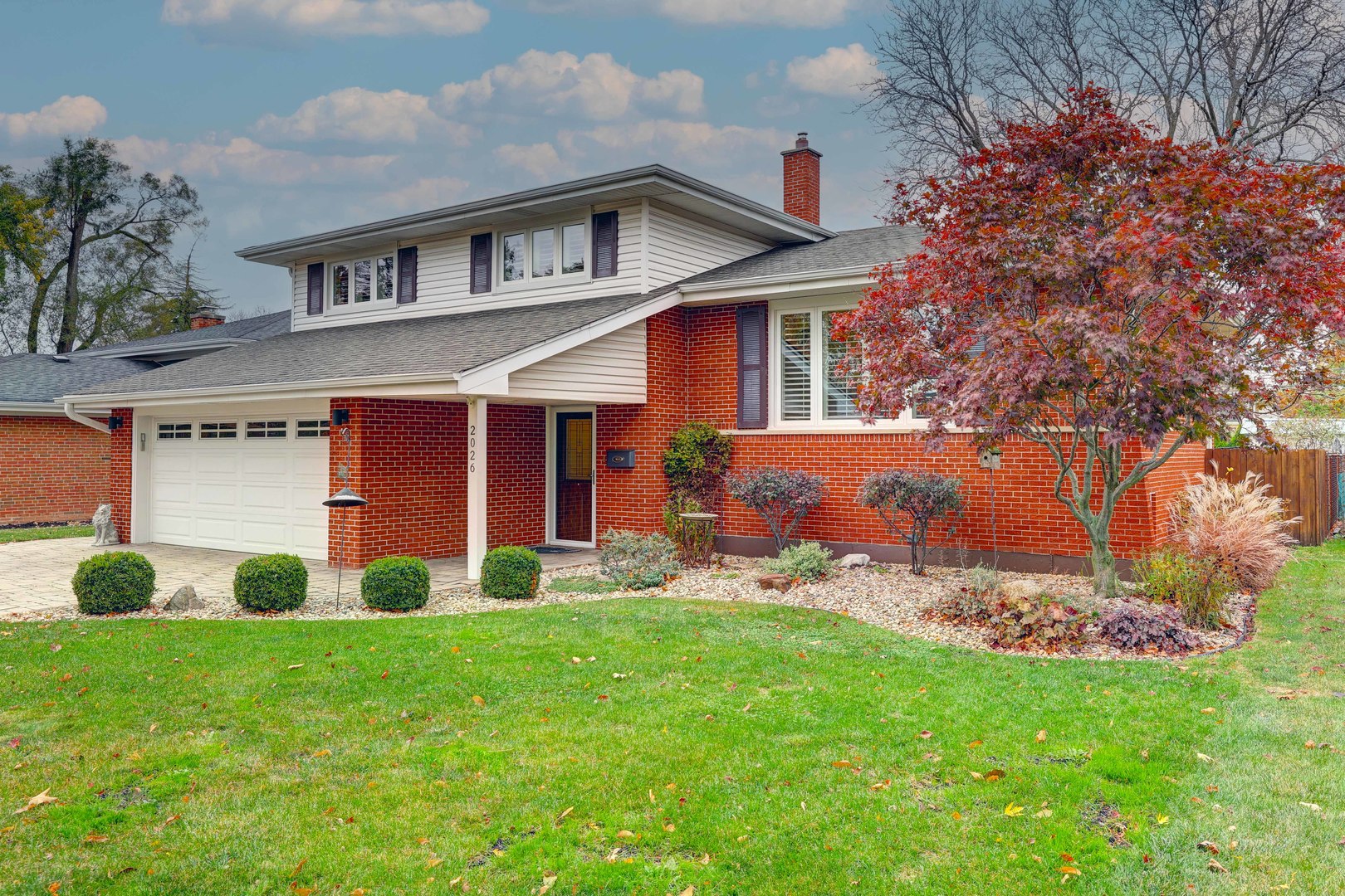 2026 Irwin Avenue Park Ridge, IL 60068 - Photo 7 of 39 a front view of a house with a yard