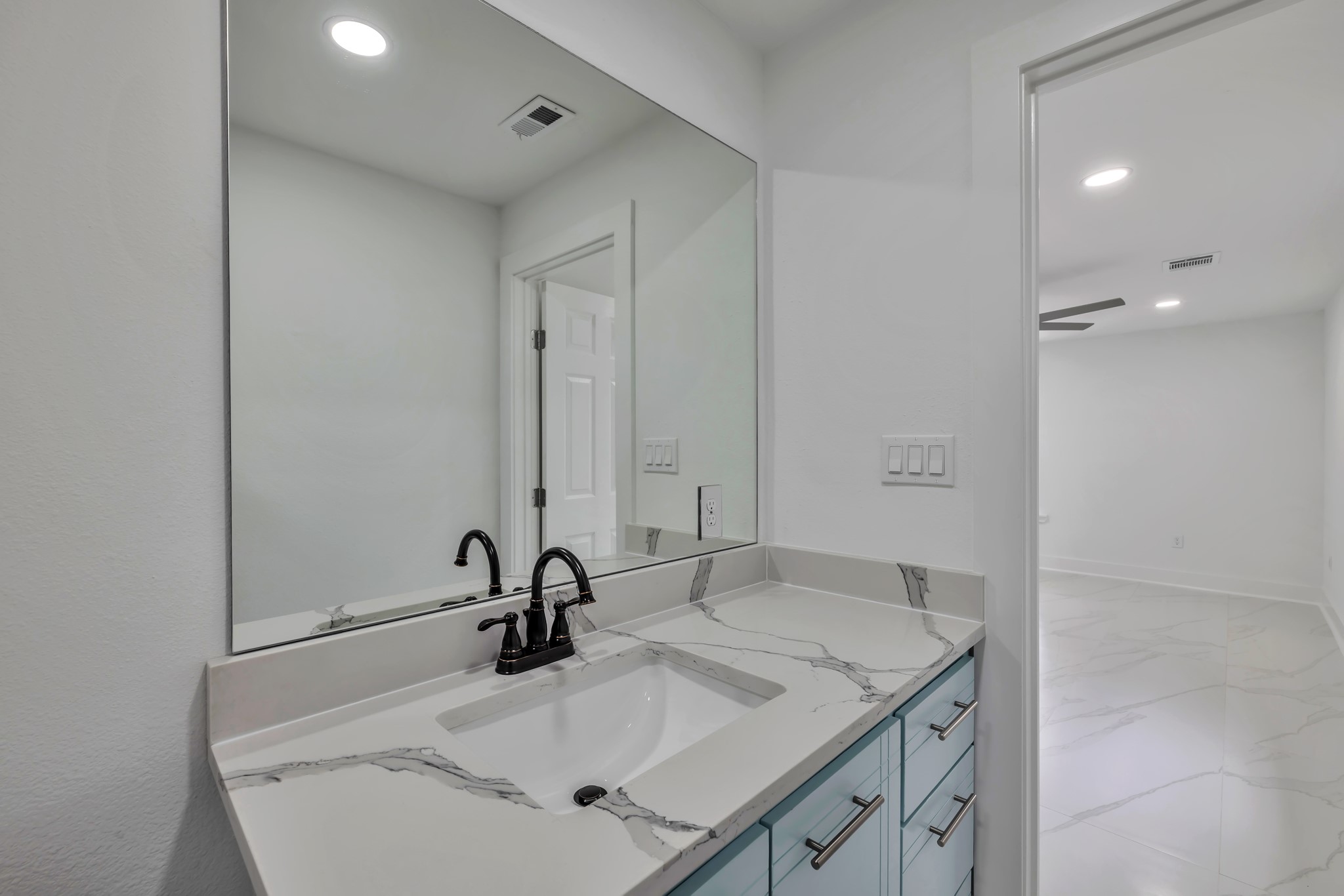 8709 Tarbell Road Houston, TX 77034 - Photo 7 of 25 a bathroom with a sink and a mirror