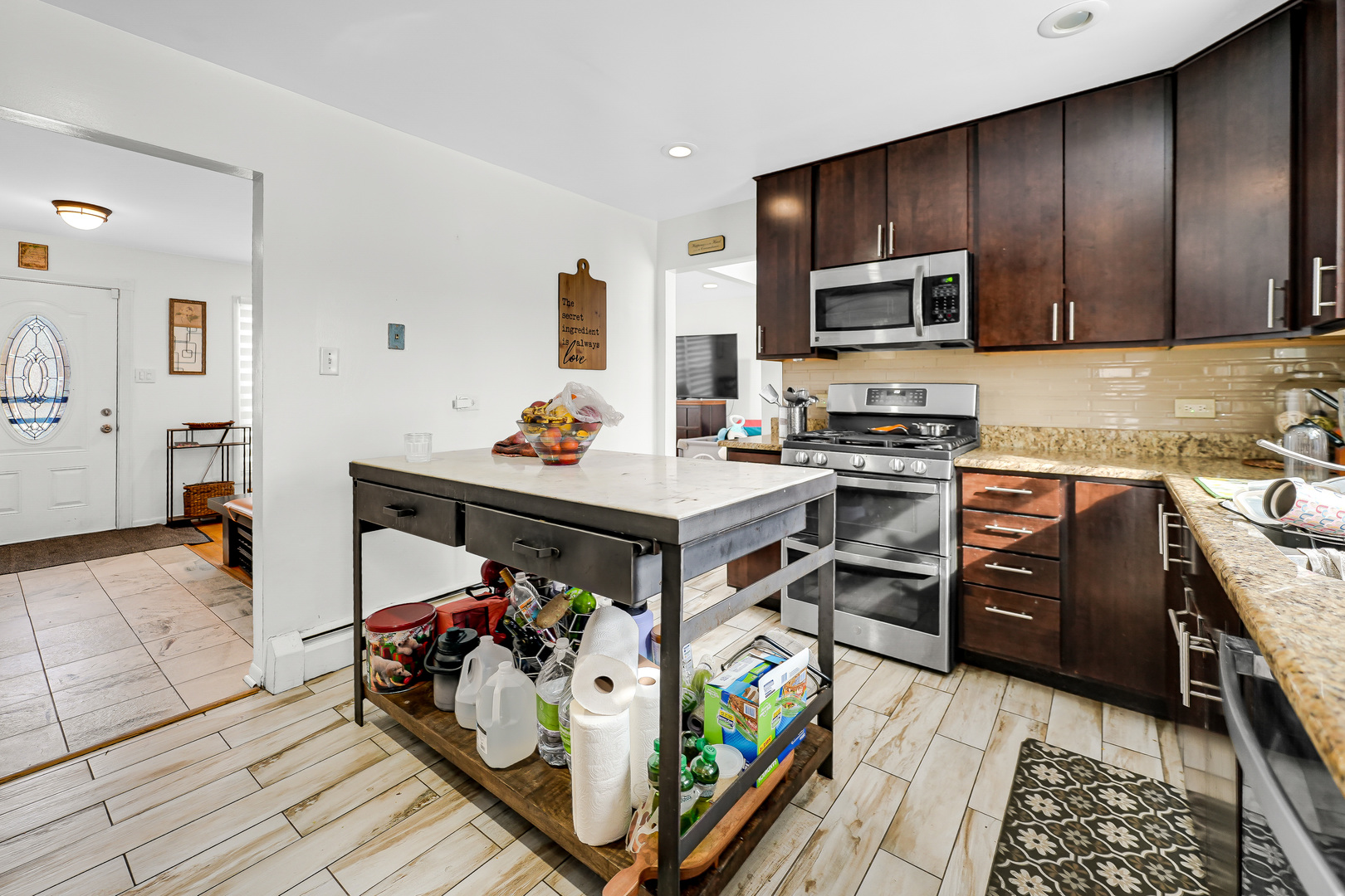 2931 Willow Road Homewood, IL 60430 - Photo 11 of 21 a bed room with stainless steel appliances furniture a rug and a kitchen view