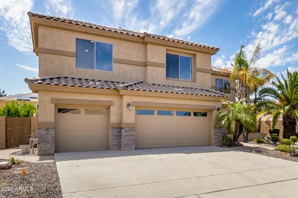 a front view of a house with a garage