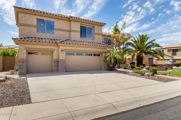 a front view of a house with a garage