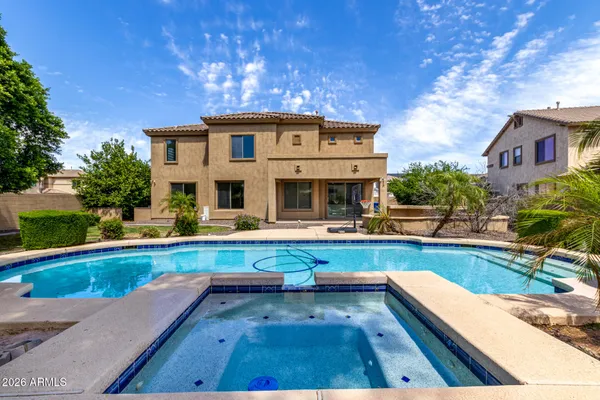 a view of swimming pool with chairs