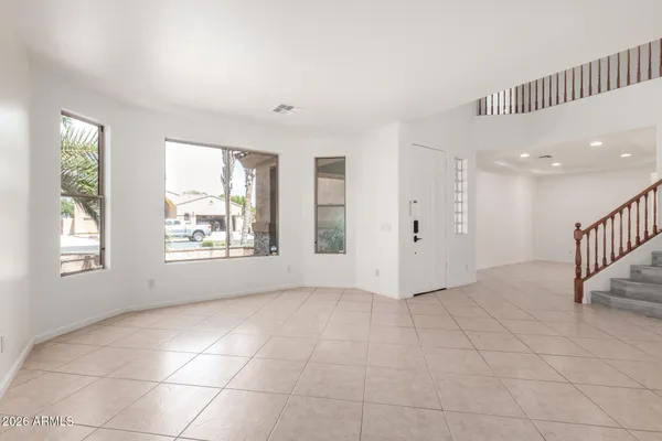 a view of an empty room with windows