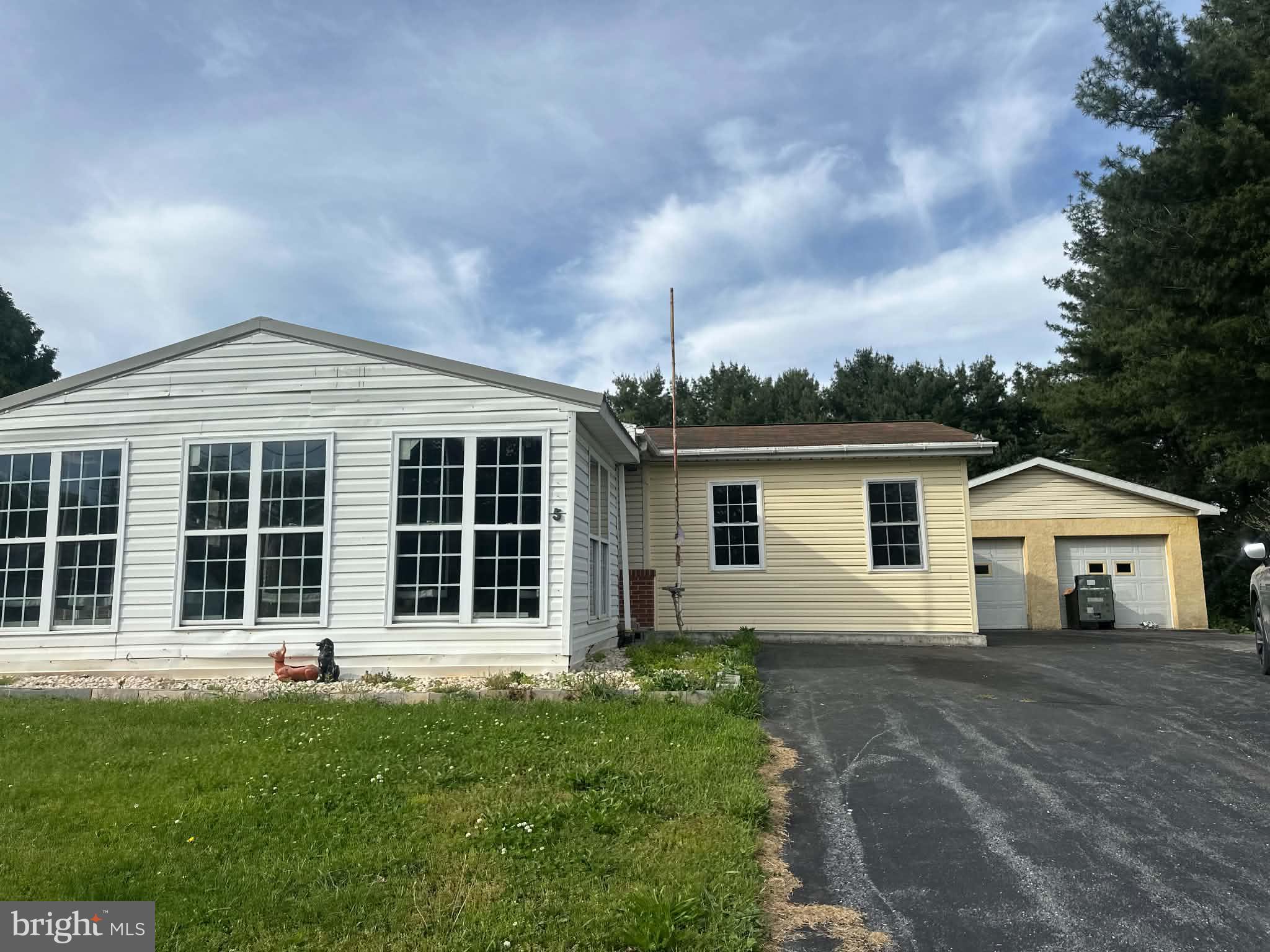 front view of a house with a yard