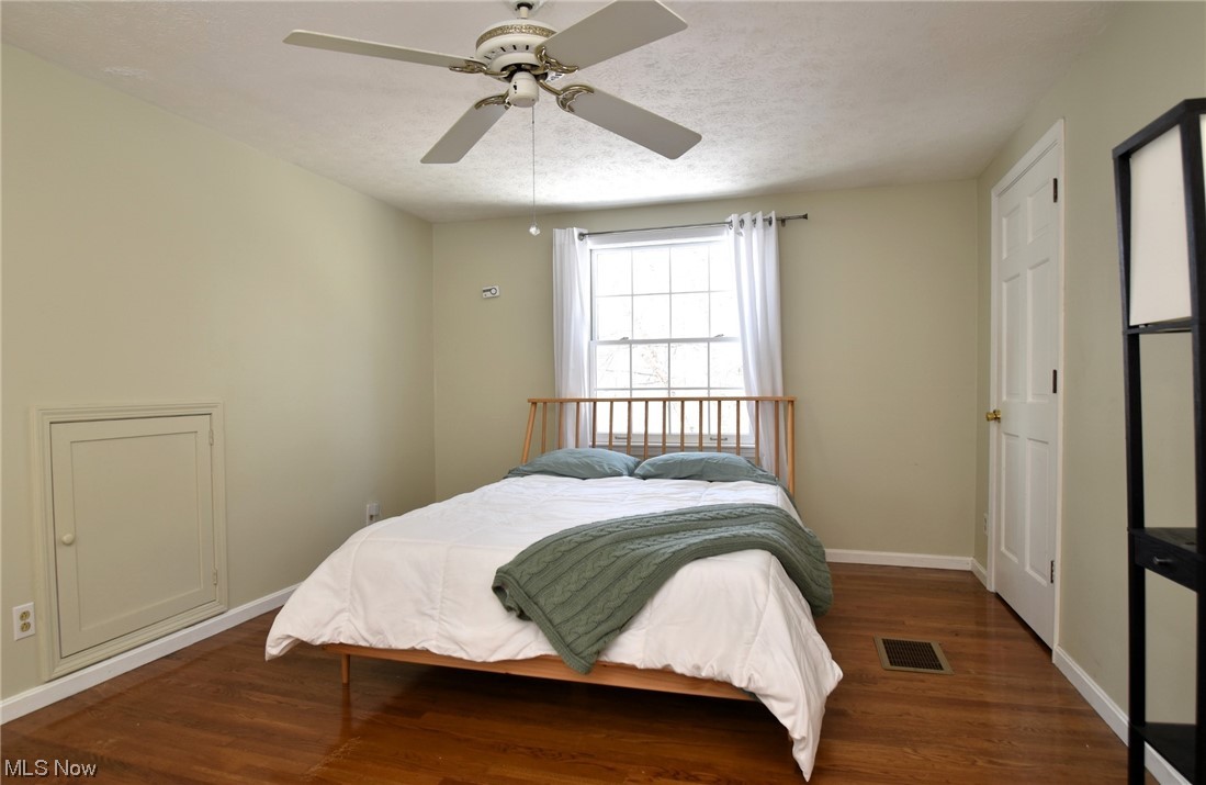 11801 Heath Road Chesterland, OH 44026 - Photo 12 of 21 Master Bedroom with ceiling fan and dark hardwood flooring