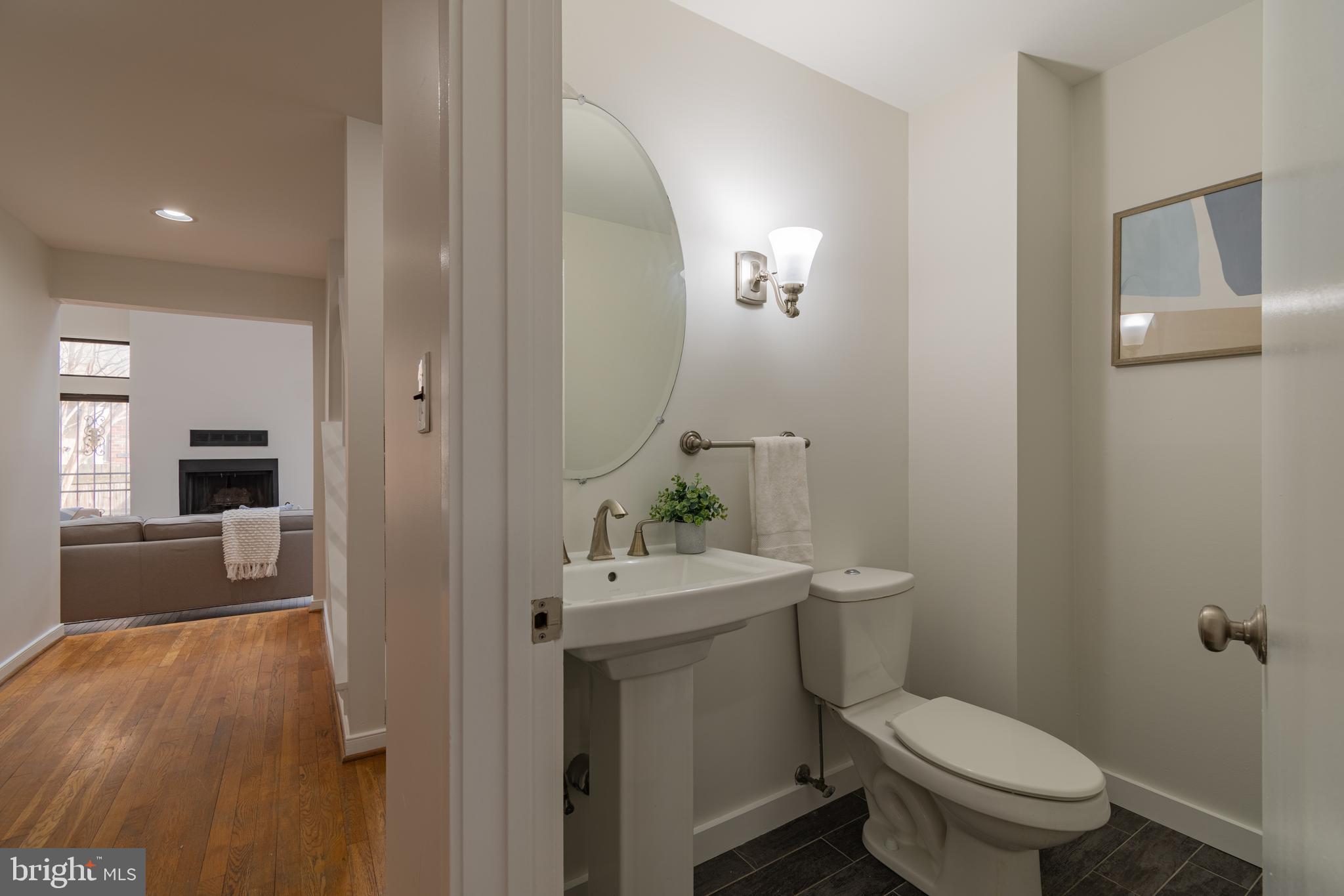205 Scott Street Baltimore, MD 21230 - Photo 21 of 51 a bathroom with a sink a toilet and mirror