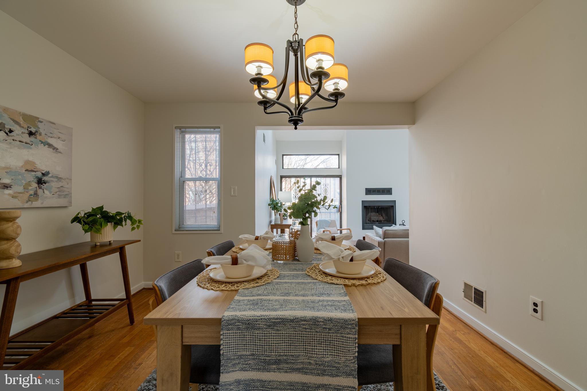 205 Scott Street Baltimore, MD 21230 - Photo 10 of 51 a view of a dining room with furniture a chandelier and wooden floor