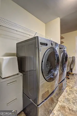 a utility room with dryer and washer