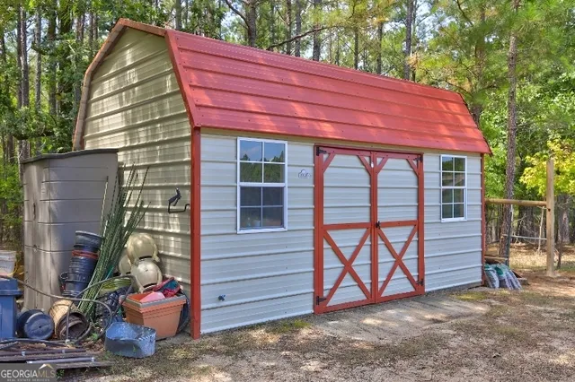a backyard of a house with yard and outdoor seating
