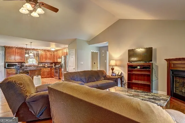 a living room with furniture and a flat screen tv