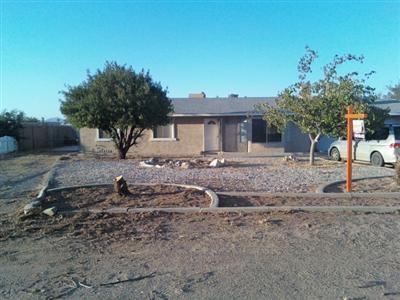 11130 Lancelet Road Apple Valley, CA 92308 - Photo 1 of 1 a backyard of a house with barbeque oven