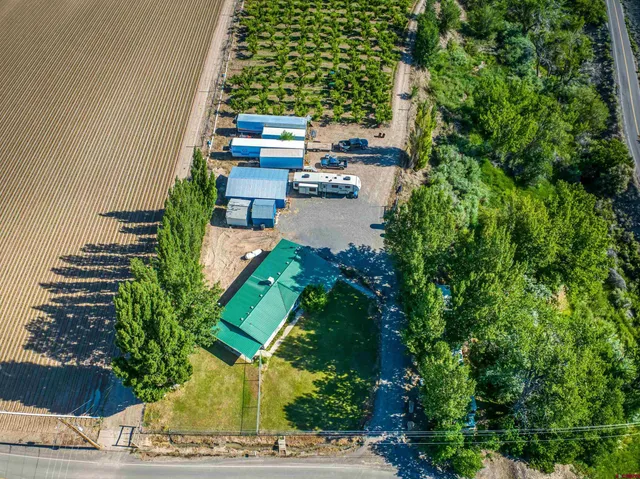 an aerial view of a house with outdoor space