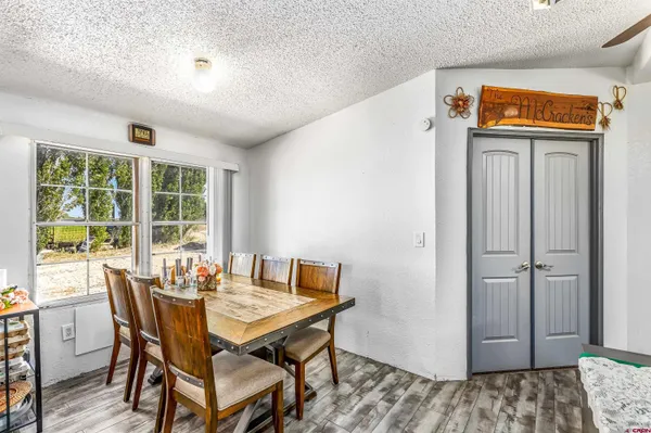 a very nice looking room with many windows and furniture
