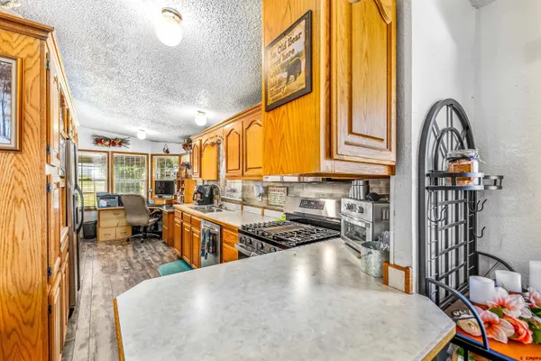 a bed room with a bed and a chandelier