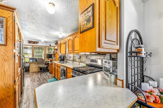 a very nice looking room with many windows and furniture