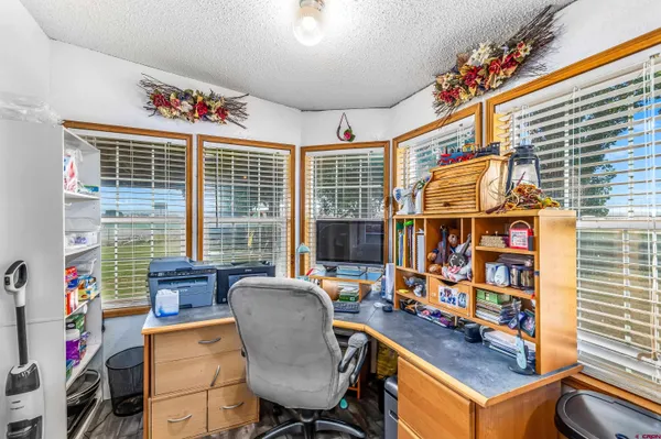 a bathroom with a sink a toilet and a shower curtain