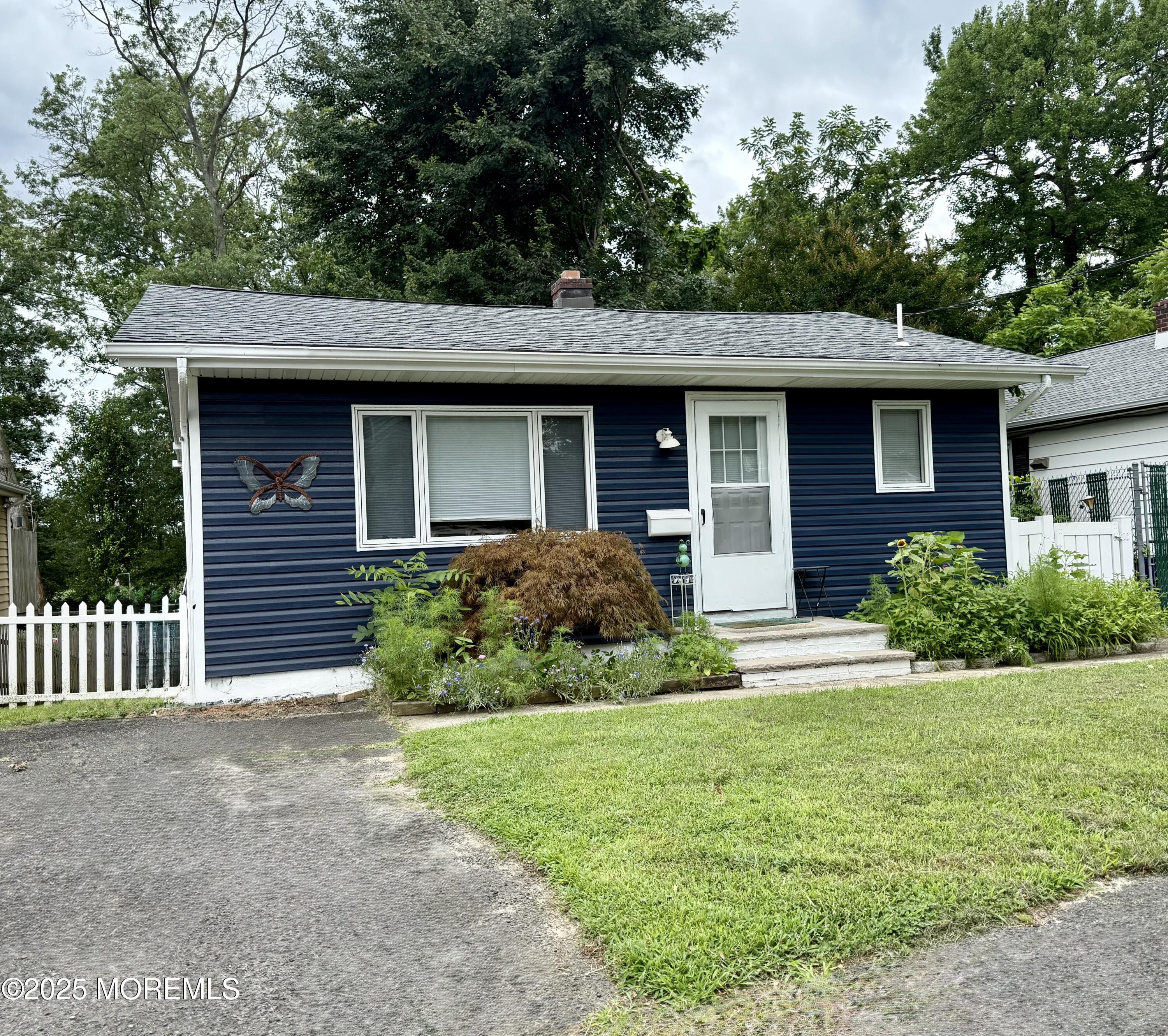 13 Middlesex Avenue Keyport, NJ 07735 - Photo 1 of 12 a front view of a house with garden