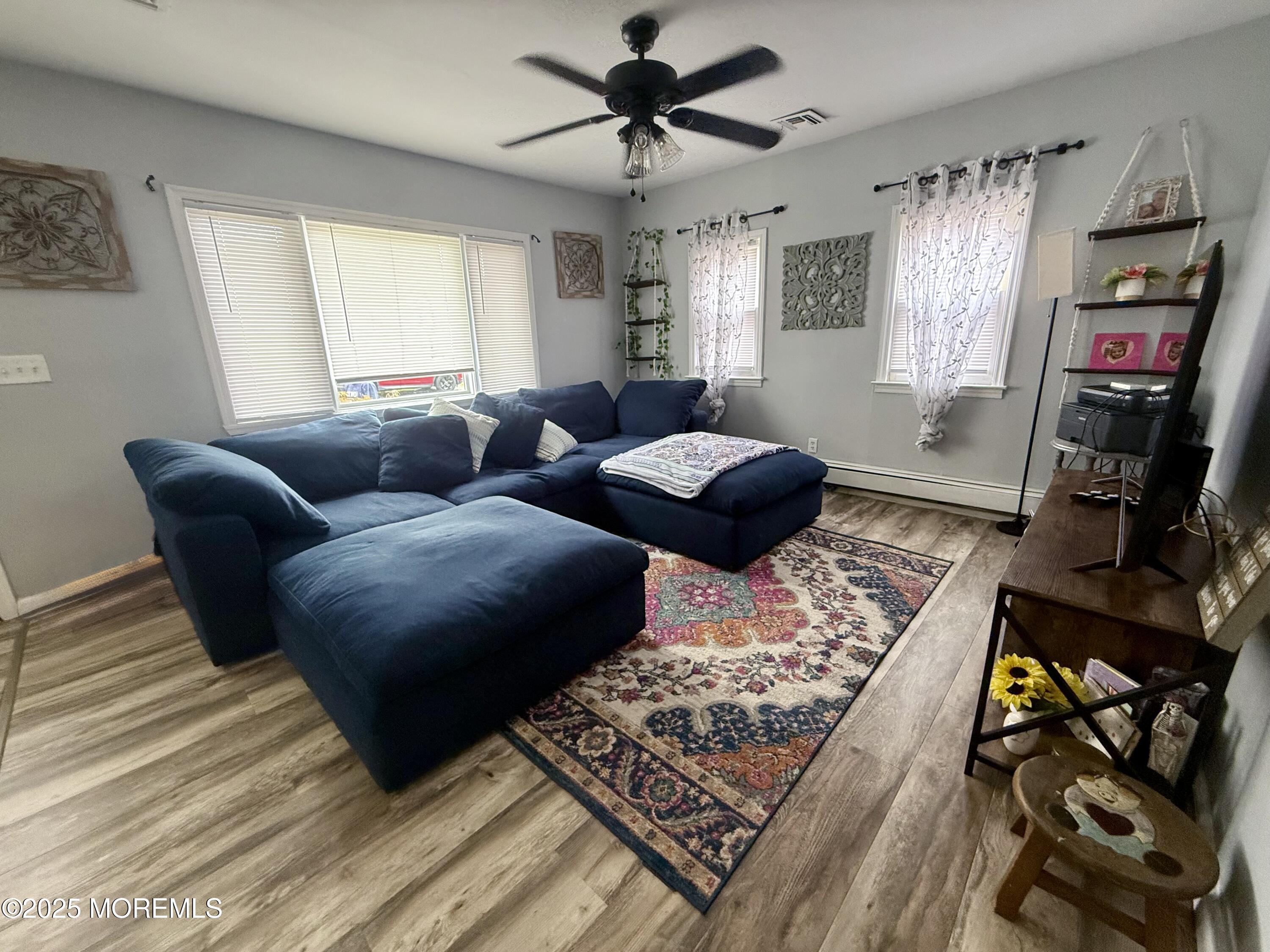 13 Middlesex Avenue Keyport, NJ 07735 - Photo 4 of 12 a living room with furniture and a flat screen tv