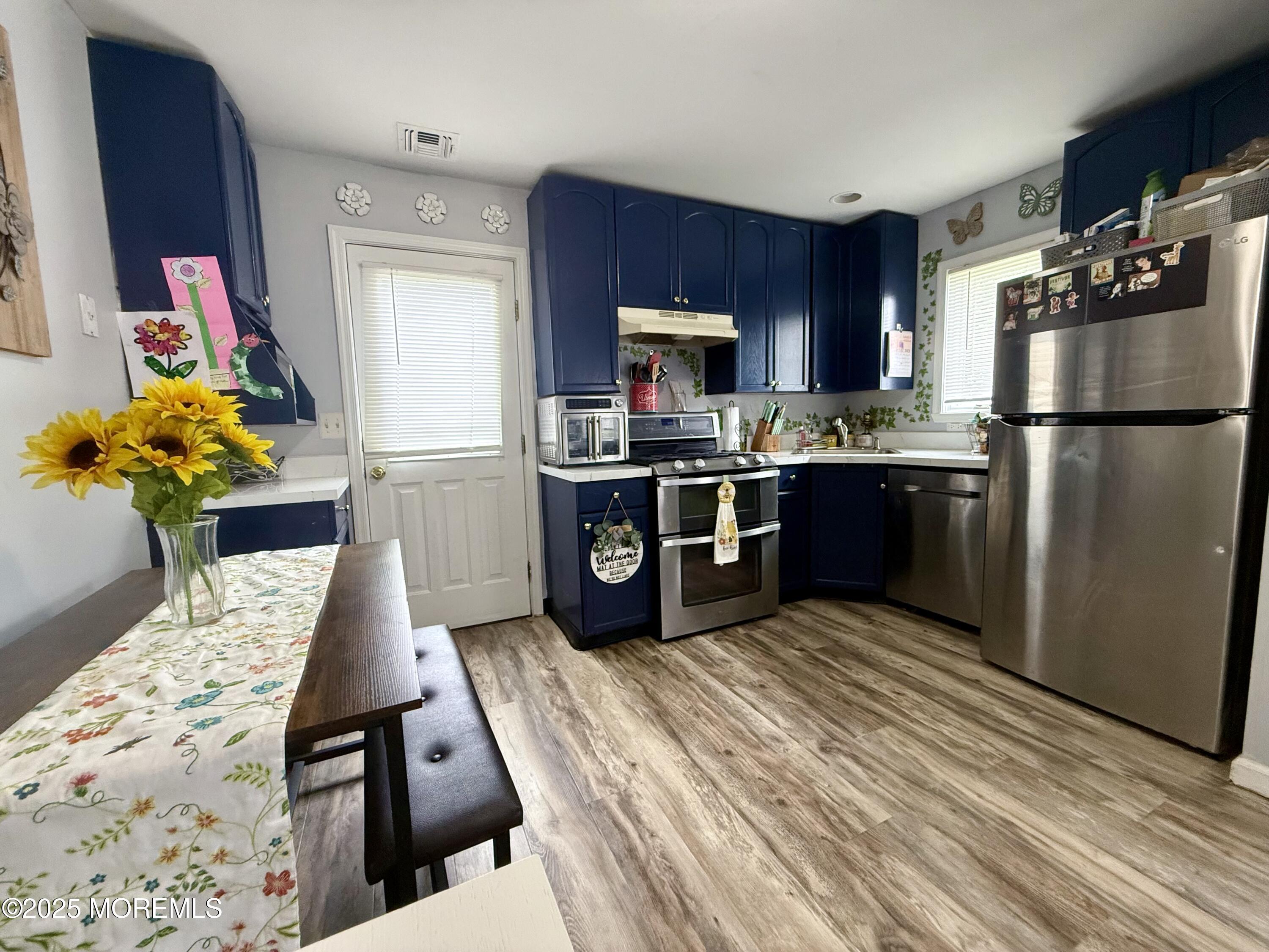 13 Middlesex Avenue Keyport, NJ 07735 - Photo 6 of 12 a kitchen with stainless steel appliances granite countertop a refrigerator a stove a sink dishwasher and a refrigerator