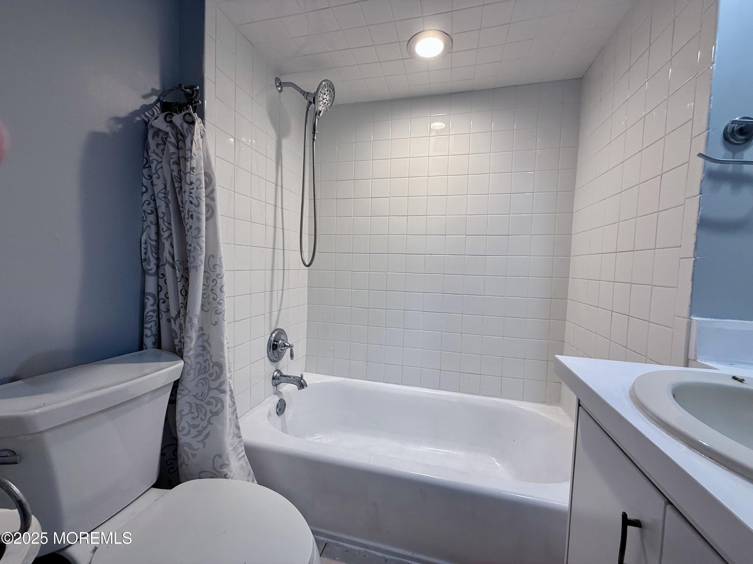 13 Middlesex Avenue Keyport, NJ 07735 - Photo 10 of 12 a bathroom with a sink toilet and shower