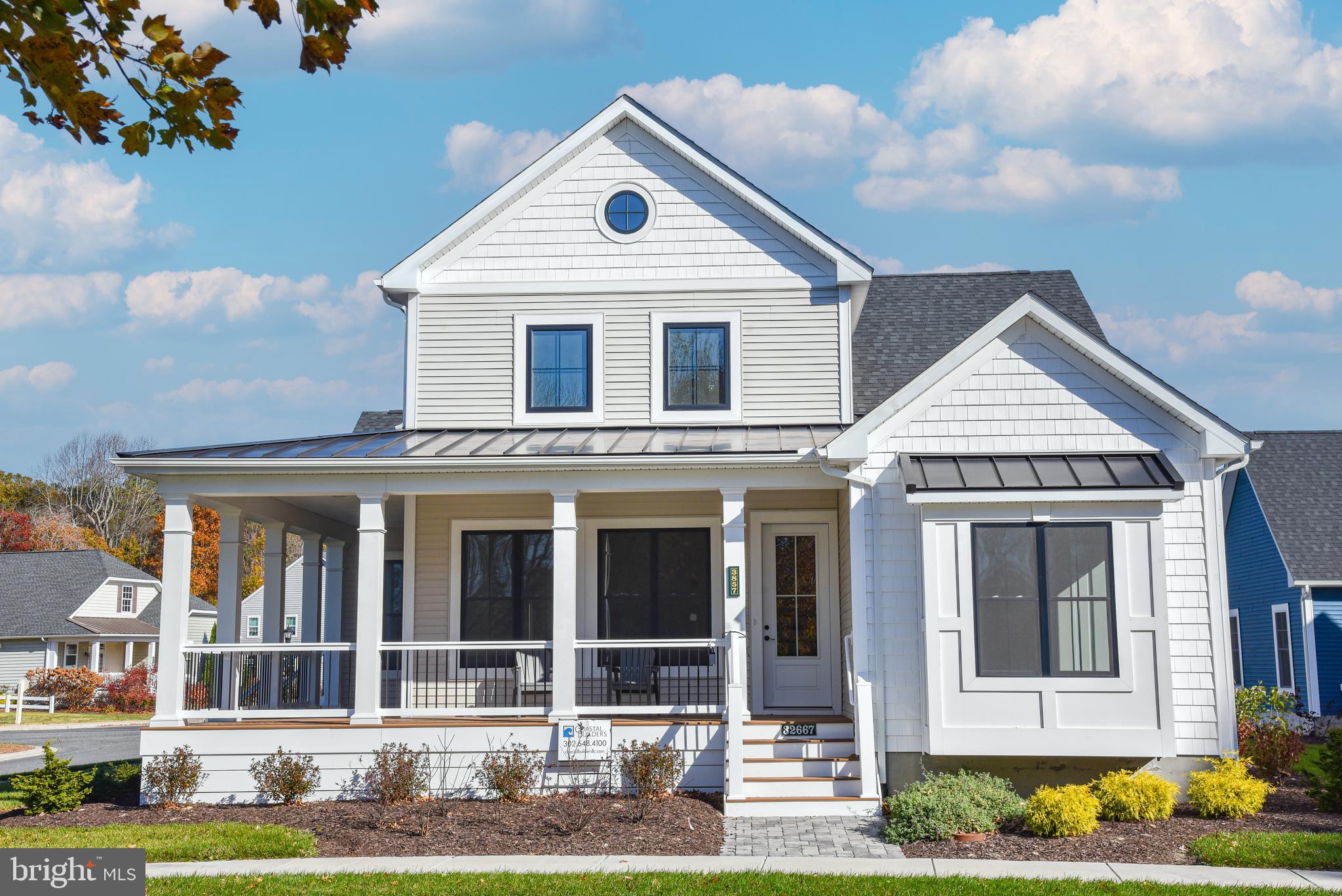 front view of a house with a yard
