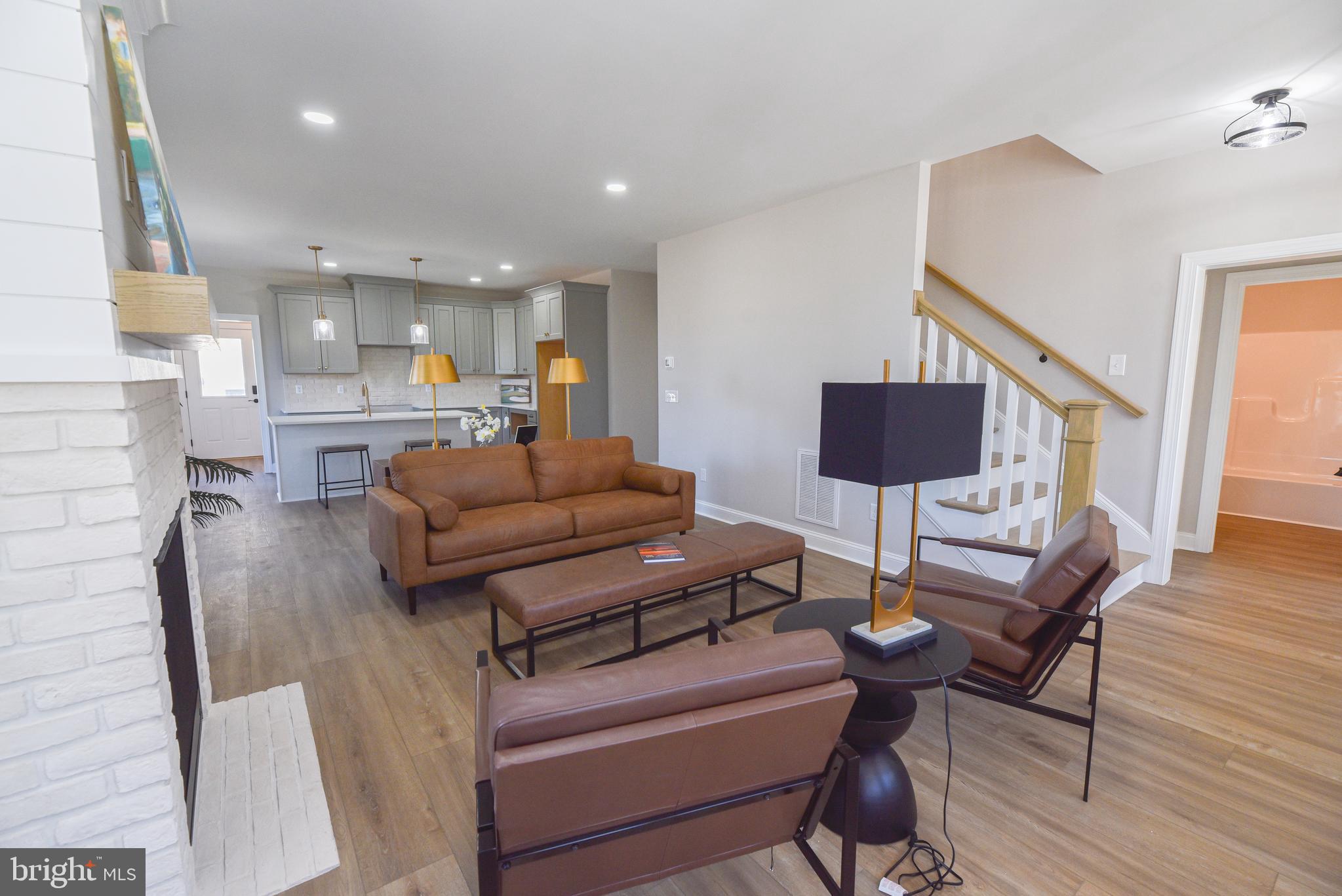 32667 Back Nine Way, Unit 3857 Long Neck, DE 19966 - Photo 14 of 74 a living room with furniture and a wooden floor