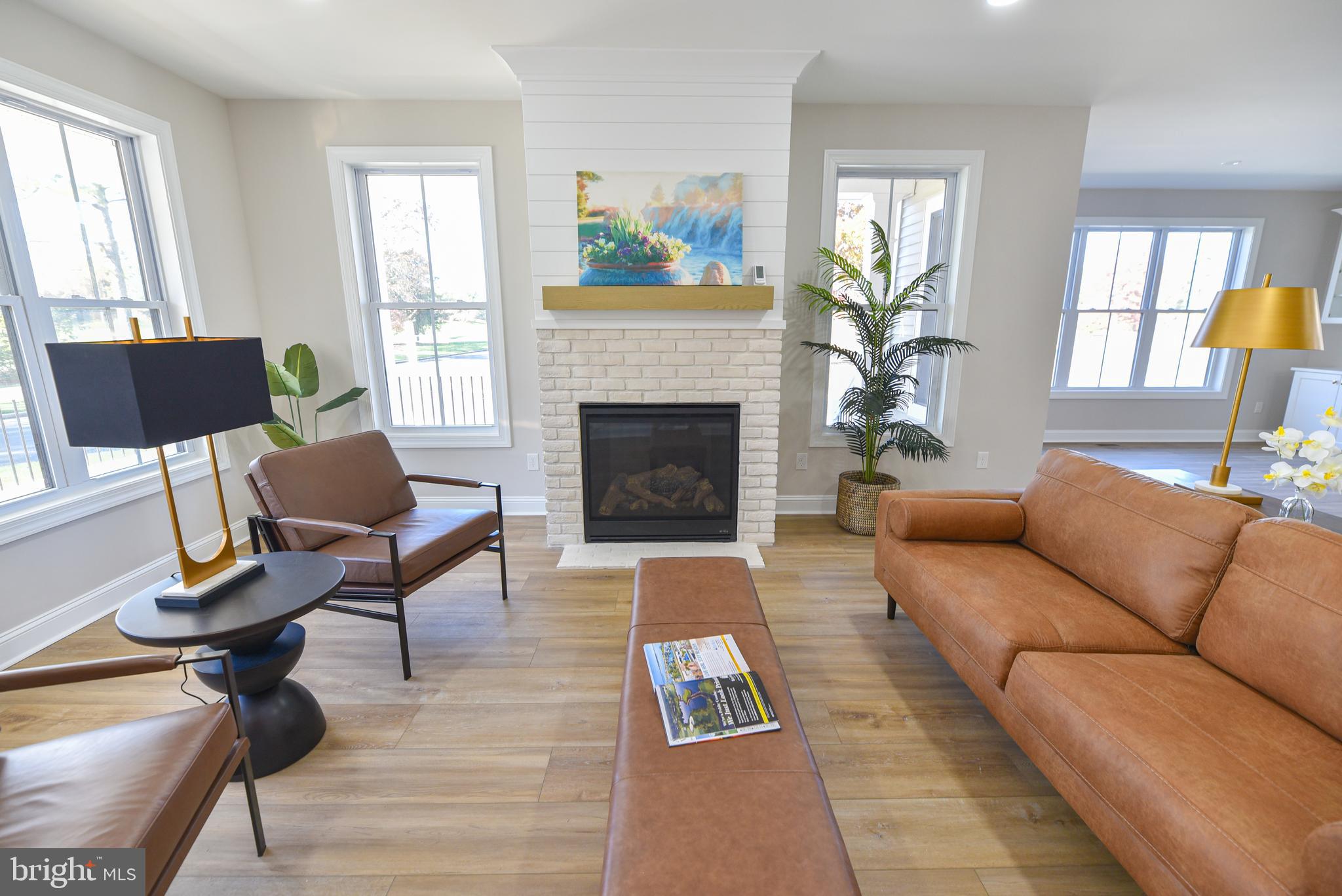 32667 Back Nine Way, Unit 3857 Long Neck, DE 19966 - Photo 17 of 74 a living room with furniture and a fireplace