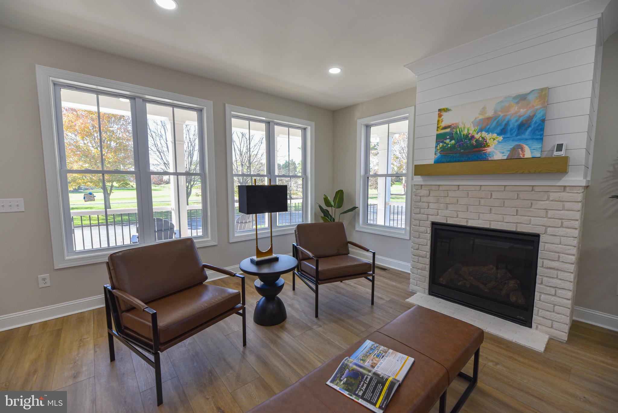 32667 Back Nine Way, Unit 3857 Long Neck, DE 19966 - Photo 18 of 74 a living room with furniture and a fireplace