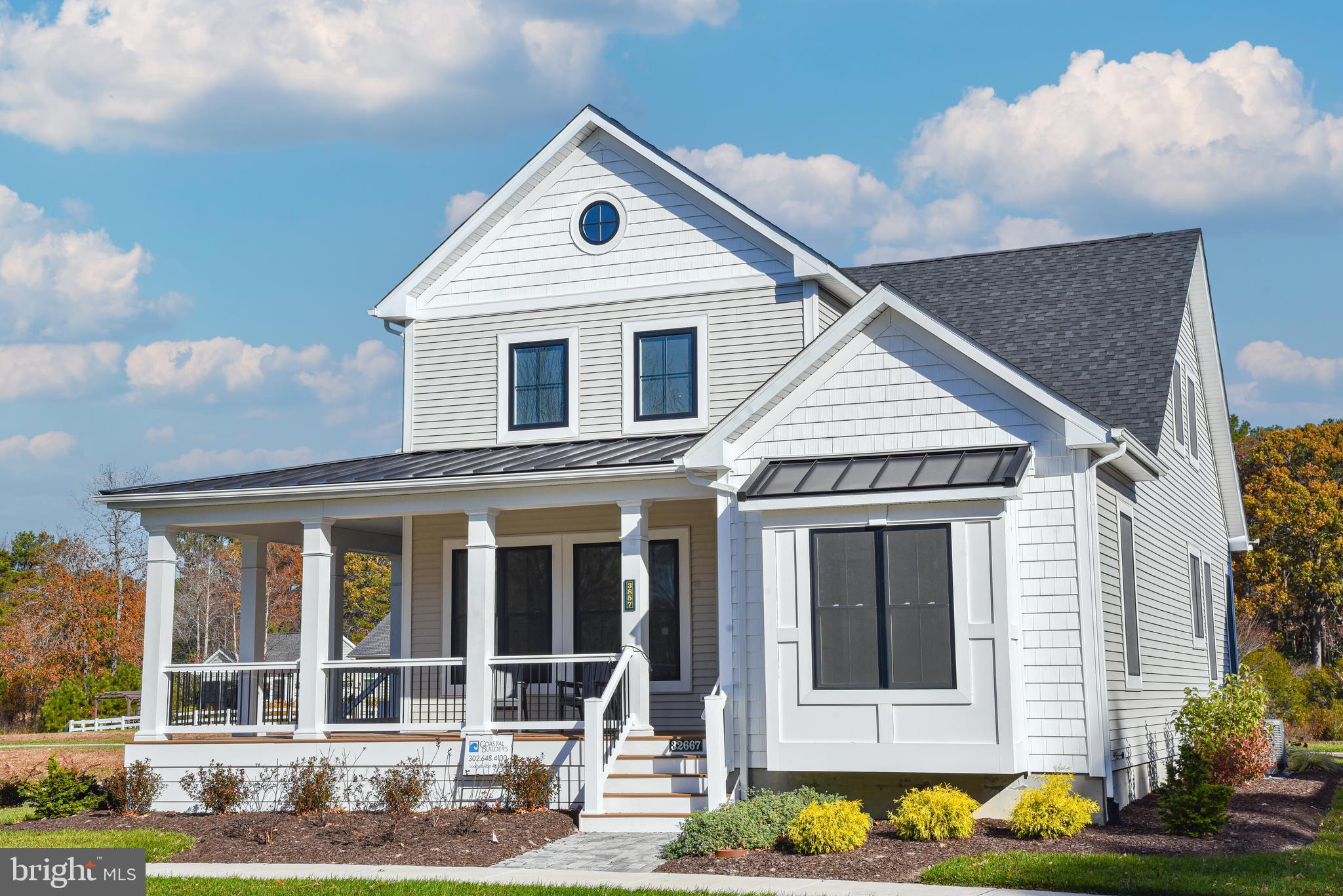 32667 Back Nine Way, Unit 3857 Long Neck, DE 19966 - Photo 2 of 74 a front view of a house with a yard