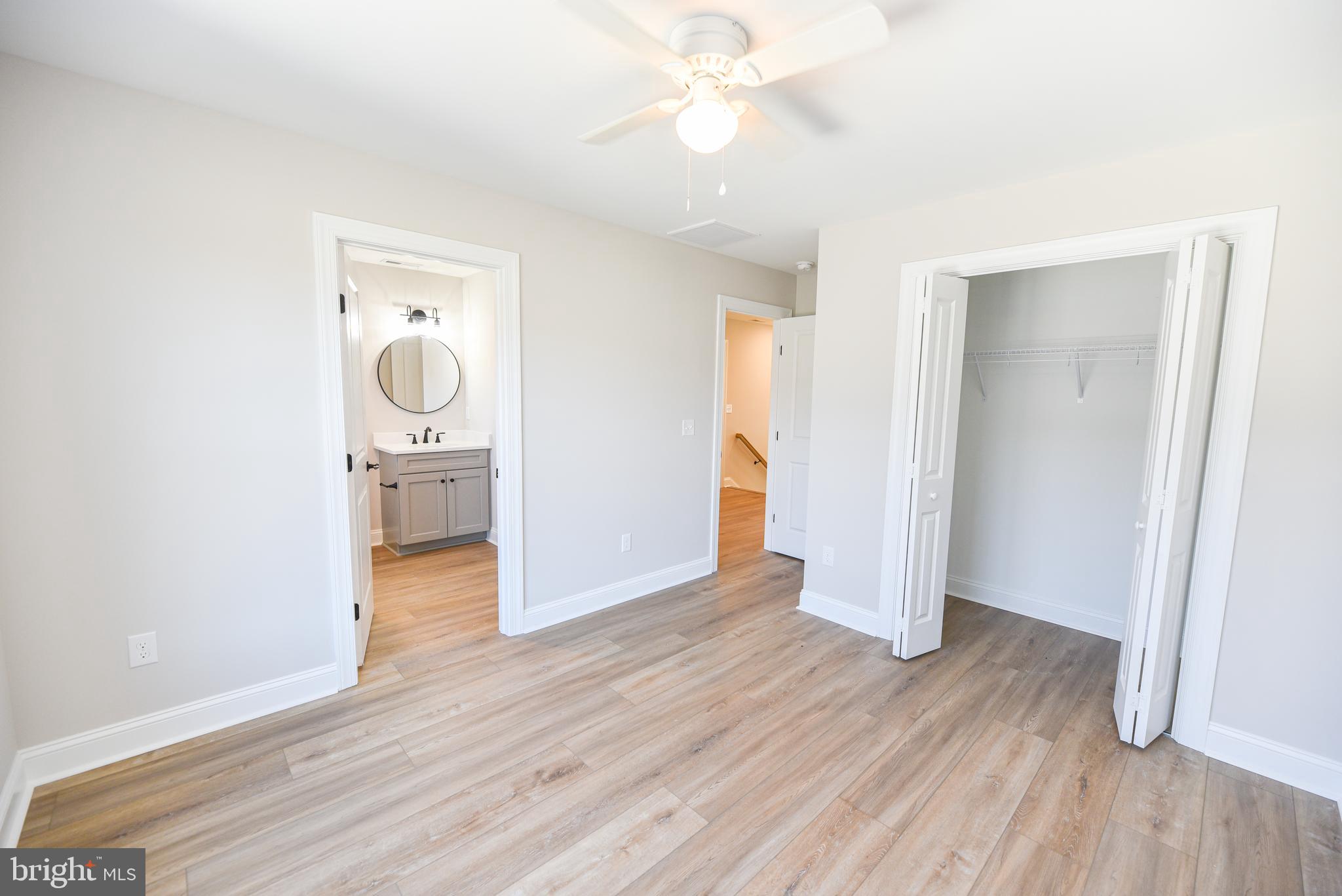 32667 Back Nine Way, Unit 3857 Long Neck, DE 19966 - Photo 58 of 74 a view of a room with wooden floor and bathroom view