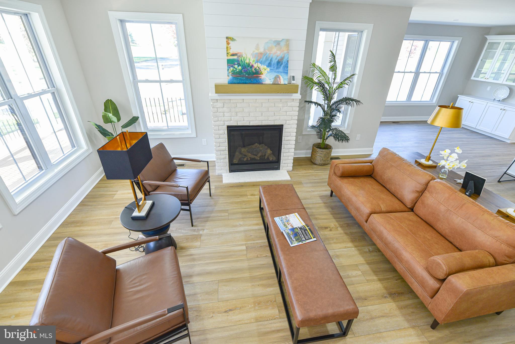 32667 Back Nine Way, Unit 3857 Long Neck, DE 19966 - Photo 64 of 74 a living room with furniture fireplace and window