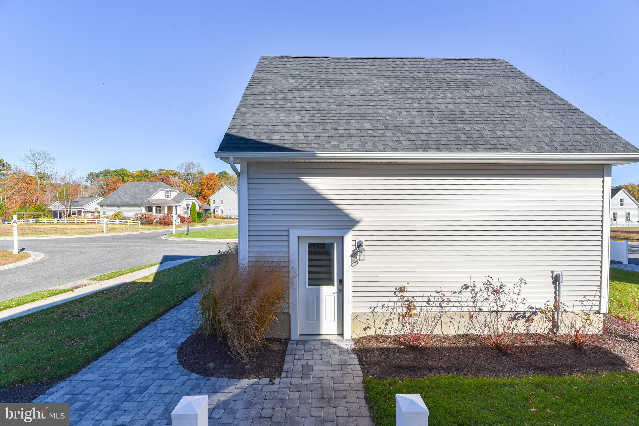 32667 Back Nine Way, Unit 3857 Long Neck, DE 19966 - Photo 66 of 74 a front view of a house with garden