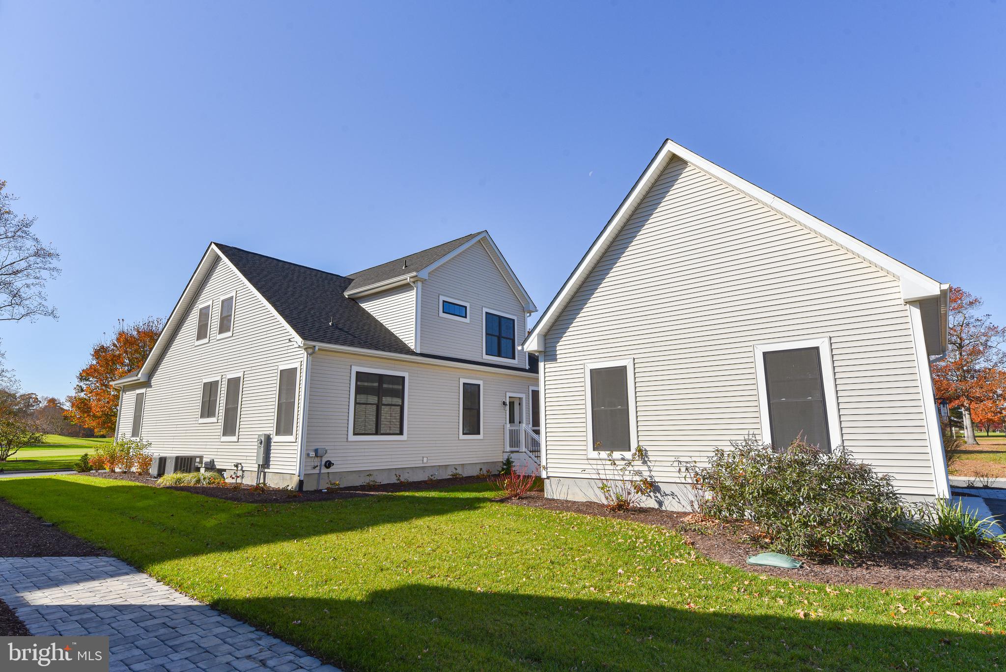 32667 Back Nine Way, Unit 3857 Long Neck, DE 19966 - Photo 69 of 74 a view of a house with a yard