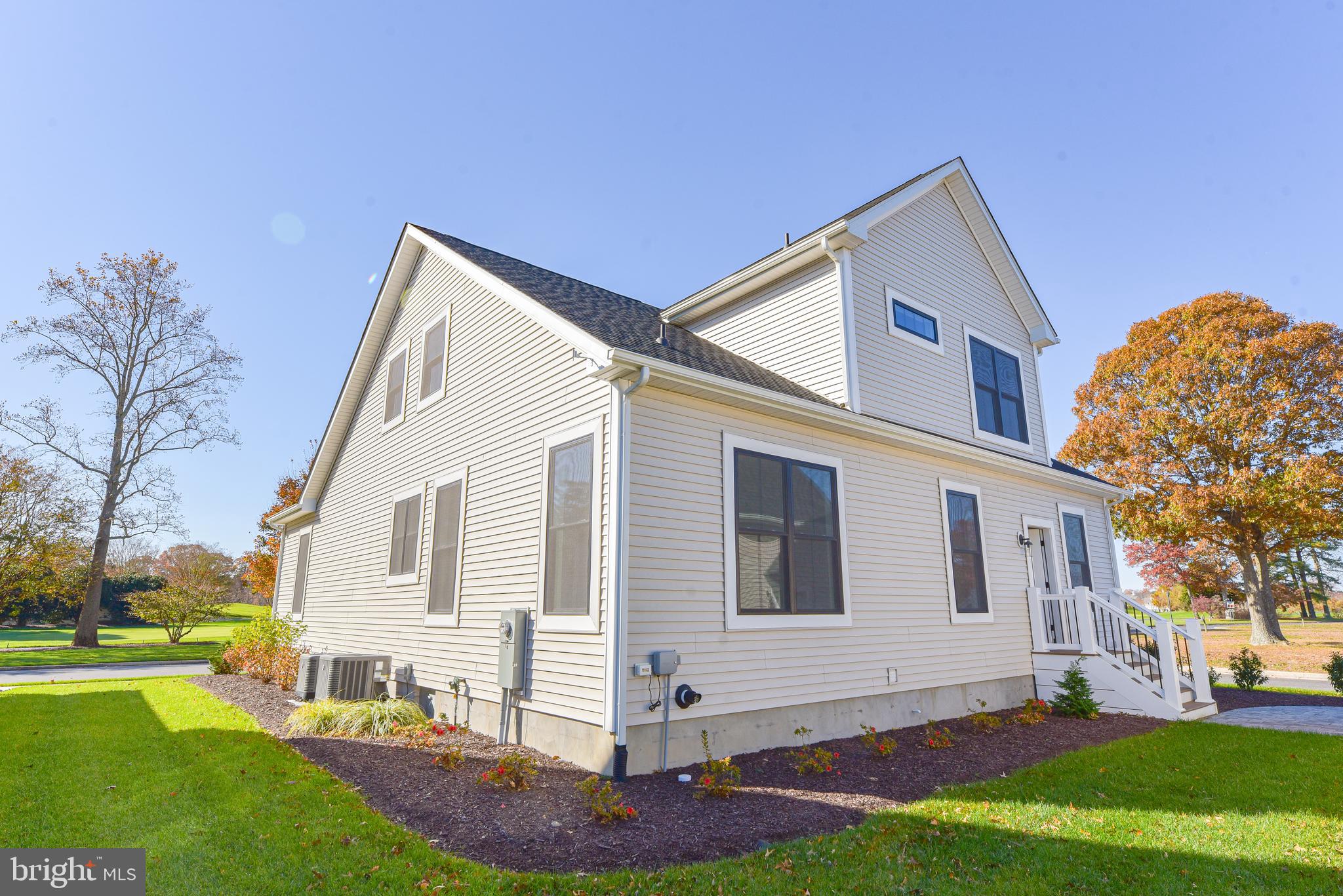 32667 Back Nine Way, Unit 3857 Long Neck, DE 19966 - Photo 70 of 74 a view of a house with a yard