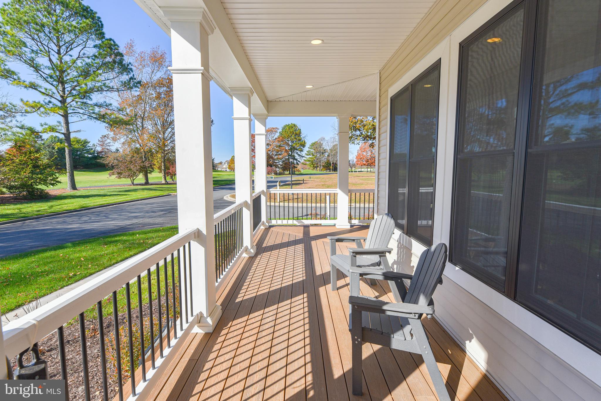32667 Back Nine Way, Unit 3857 Long Neck, DE 19966 - Photo 71 of 74 a view of balcony with wooden floor and outdoor seating