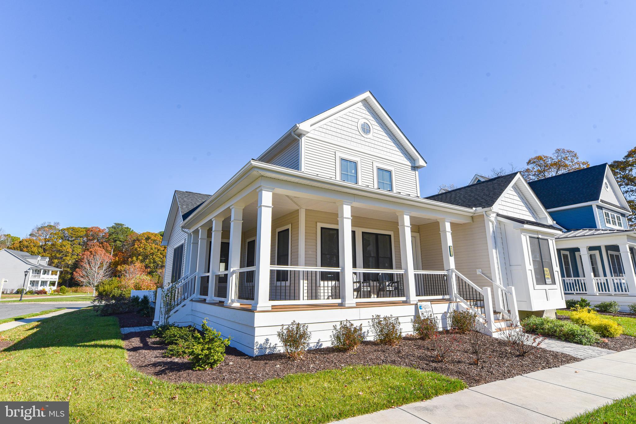 32667 Back Nine Way, Unit 3857 Long Neck, DE 19966 - Photo 73 of 74 a front view of a house with a yard