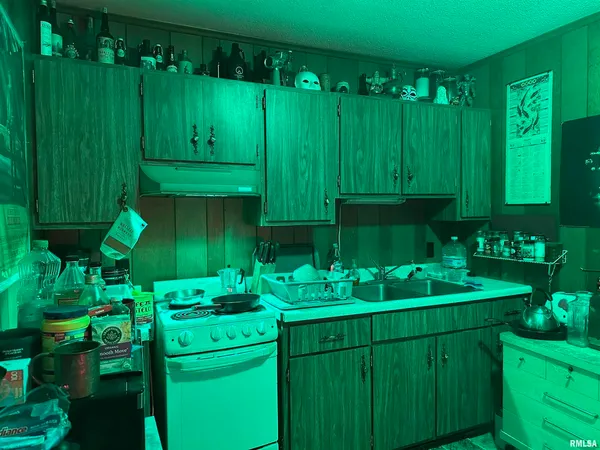 a room filled with lots of potted plants and a dining table