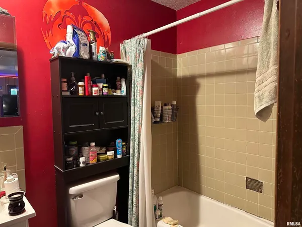 a bedroom with a bed and flat screen tv