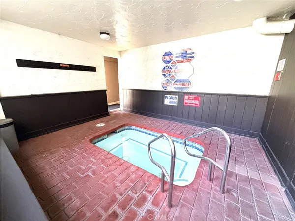 a living room with a rug and a table